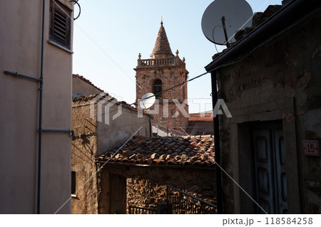 Rustic village rooftops with historic bell tower in Mediterranean setting Rustic village rooftops with historic bell tower in Mediterranean setting 118584258