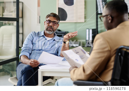 Discussing Business Strategy in Office Setting Discussing Business Strategy in Office Setting 118590278