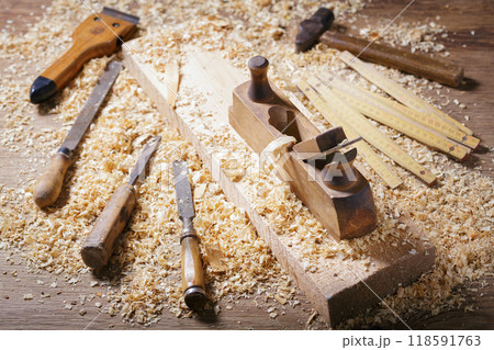 old tools: wooden planer, hammer, chisel  in a carpentry workshop 118591763
