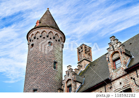 Bruges, Belgium; view of the medieval buildings that are crossed by the canals of the city. Historic center World Heritage	 118592282
