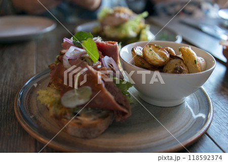 Close up of delicious nordic dish with salad, potatoes and meat Close up of delicious nordic dish with salad, potatoes and meat 118592374