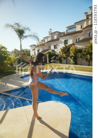Experience the Joyful Summer Vibes while lounging by the Poolside enjoying every moment 118593793