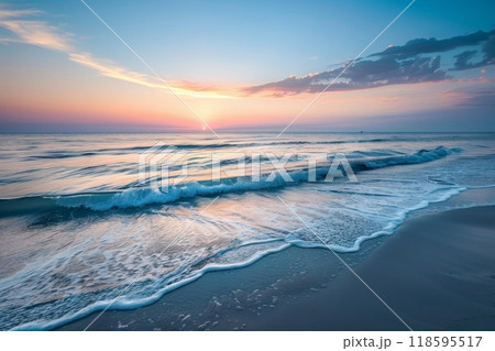 Pastel sunset over calm ocean waves 118595517