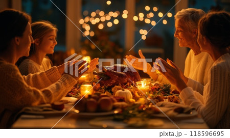 Family Giving Thanks at a Festive Dinner Table 118596695