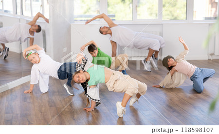 Group of children dancers having break dance training at dance studio Group of children dancers having break dance training at dance studio 118598107