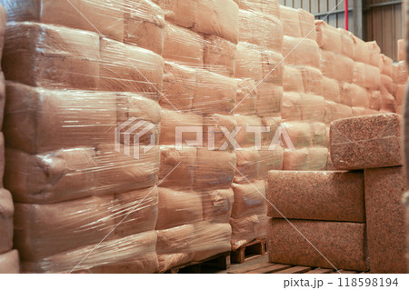Lots of bags stacked in warehouse 118598194