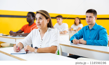Woman attending lecture in taxi training school 118598196