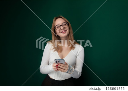 Woman Wearing Glasses Holding Cell Phone 118601853