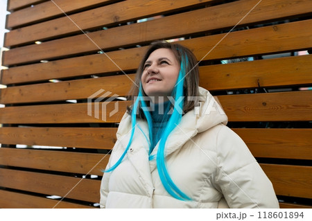 Woman With Blue Hair Standing in Front of Wooden Wall 118601894