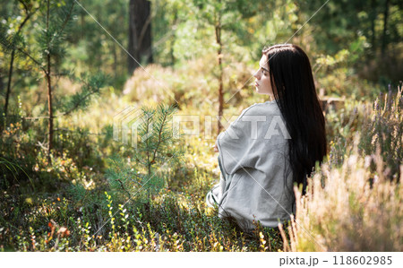 A tranquil moment of reflection in a serene forest setting during daylight hours 118602985