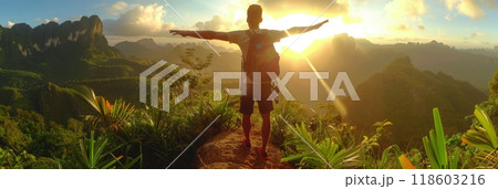 Tourist athlete rejoices climbing a mountain in a tropical country, success and goal achievement concept, man raised his hands up in delight, banner 118603216