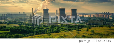 View from afar of a nuclear power plant, operating nuclear reactors against the backdrop of nature, peaceful atom, banner 118603235