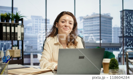 Portrait of determined female leader focuses on expanding the enterprise global footprint, using her knowledge of international markets and cultural awareness to drive business success. Camera B. Portrait of determined female leader focuses on expanding the enterprise global footprint, using her knowledge of international markets and cultural awareness to drive business success. Camera B. 118604284