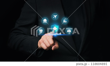 Insurance technology (Insurtech) concept and businessman pressing on text with virtual screen. Insurance technology (Insurtech) concept and businessman pressing on text with virtual screen. 118604891