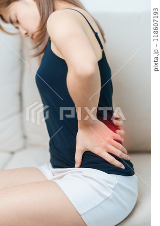 woman having back body ache during at home. adult female with muscle pain due to Piriformis Syndrome, Low Back Pain and Spinal Compression. Office syndrome and medical concept 118607193