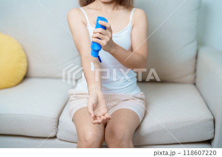 Skin care lotion and Skin body cream Moisturizing, Sunscreen and Healthy Daily Routine concepts. Beauty Woman applying moisturizing skincare cream on hand and body at home 118607220
