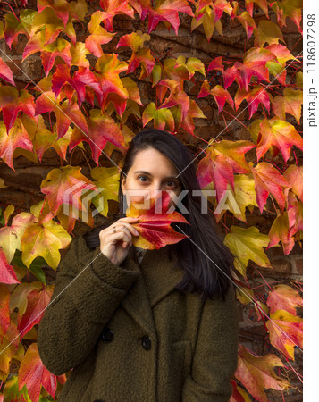 Stylish Woman in Autumn Foliage Stylish Woman in Autumn Foliage 118607298