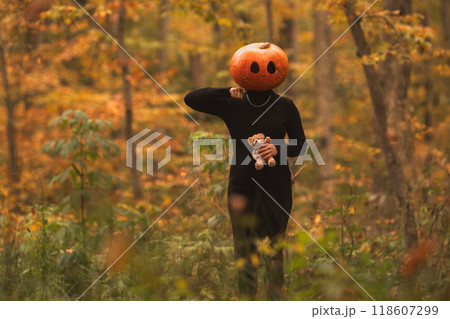 Surreal Pumpkin Head in Autumn Forest Surreal Pumpkin Head in Autumn Forest 118607299