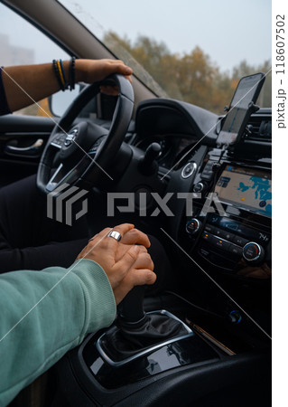 couple holding hands in road trip couple holding hands in road trip 118607502