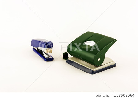 Stationery - punch and stapler on white background Stationery - punch and stapler on white background 118608064