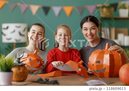 Happy family preparing for Halloween. Happy family preparing for Halloween. 118609013