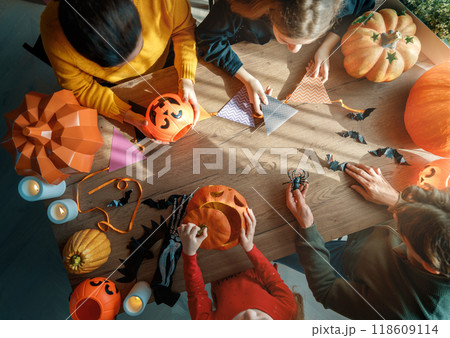 Happy family preparing for Halloween. Happy family preparing for Halloween. 118609114