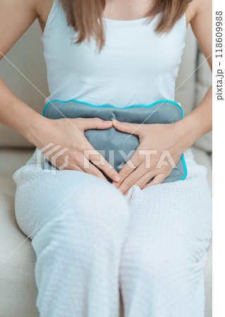 Menstruation period cycle of monthly and Stomachache concepts. woman having abdomen pain and menstrual ache with hot water bottle, illness female suffer from premenstrual ache and body Health problem Menstruation period cycle of monthly and Stomachache concepts. woman having abdomen pain and menstrual ache with hot water bottle, illness female suffer from premenstrual ache and body Health problem 118609988