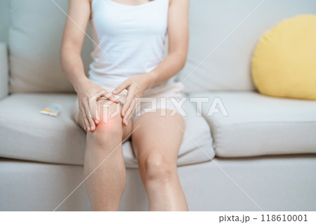 Arthritis and Muscle Pain Relief Cream concept. woman having knee ache and muscle pain due to Runners Knee or Patellofemoral Pain Syndrome, osteoarthritis, rheumatism and Patellar Tendinitis Arthritis and Muscle Pain Relief Cream concept. woman having knee ache and muscle pain due to Runners Knee or Patellofemoral Pain Syndrome, osteoarthritis, rheumatism and Patellar Tendinitis 118610001