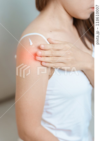 Arthritis and Muscle Pain Relief Cream concept. Woman having Shoulder and Arm pain at home. Muscle painful due to Myofascial pain syndrome and Fibromyalgia, rheumatism, Scapular pain, Cervical Spine Arthritis and Muscle Pain Relief Cream concept. Woman having Shoulder and Arm pain at home. Muscle painful due to Myofascial pain syndrome and Fibromyalgia, rheumatism, Scapular pain, Cervical Spine 118610007