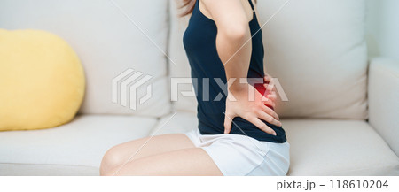woman having back body ache during at home. adult female with muscle pain due to Piriformis Syndrome, Low Back Pain and Spinal Compression. Office syndrome and medical concept woman having back body ache during at home. adult female with muscle pain due to Piriformis Syndrome, Low Back Pain and Spinal Compression. Office syndrome and medical concept 118610204