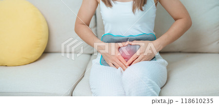 Menstruation period cycle of monthly and Stomachache concepts. woman having abdomen pain and menstrual ache with hot water bottle, illness female suffer from premenstrual ache and body Health problem Menstruation period cycle of monthly and Stomachache concepts. woman having abdomen pain and menstrual ache with hot water bottle, illness female suffer from premenstrual ache and body Health problem 118610235