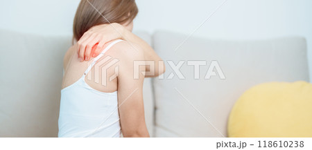 Woman having Shoulder and Neck pain at home. Muscle painful due to Myofascial pain syndrome and Fibromyalgia, rheumatism, Scapular pain, Cervical Spine. ergonomic concept 118610238