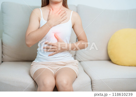Gastroesophageal Reflux Disease or GERD, Acid reflux disease, Gastro Oesophageal or GORD and Dyspepsia concept. woman having Stomach ache and Esophageal pain due to Digestion system problem 118610239
