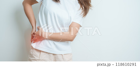woman having back body ache during at home. adult female with muscle pain due to Piriformis Syndrome, Low Back Pain and Spinal Compression. Office syndrome and medical concept woman having back body ache during at home. adult female with muscle pain due to Piriformis Syndrome, Low Back Pain and Spinal Compression. Office syndrome and medical concept 118610291