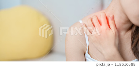 Woman having Shoulder and Neck pain at home. Muscle painful due to Myofascial pain syndrome and Fibromyalgia, rheumatism, Scapular pain, Cervical Spine. ergonomic concept 118610389