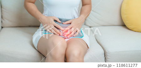 Menstruation period cycle of monthly and Stomachache concepts. woman having abdomen pain and menstrual ache with hot water bottle, illness female suffer from premenstrual ache and body Health problem Menstruation period cycle of monthly and Stomachache concepts. woman having abdomen pain and menstrual ache with hot water bottle, illness female suffer from premenstrual ache and body Health problem 118611277