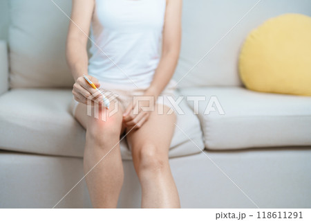Arthritis and Muscle Pain Relief Cream concept. woman having knee ache and muscle pain due to Runners Knee or Patellofemoral Pain Syndrome, osteoarthritis, rheumatism and Patellar Tendinitis Arthritis and Muscle Pain Relief Cream concept. woman having knee ache and muscle pain due to Runners Knee or Patellofemoral Pain Syndrome, osteoarthritis, rheumatism and Patellar Tendinitis 118611291