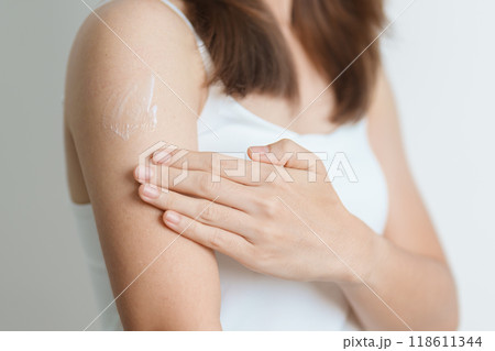 Skin care lotion and Skin body cream Moisturizing, Sunscreen and Healthy Daily Routine concepts. Beauty Woman applying moisturizing skincare cream on arm and body at home Skin care lotion and Skin body cream Moisturizing, Sunscreen and Healthy Daily Routine concepts. Beauty Woman applying moisturizing skincare cream on arm and body at home 118611344