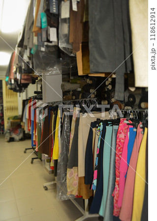 Interior of an industrial warehouse with fabric rolls samples. Small business textile colorful warehouse. Interior of an industrial warehouse with fabric rolls samples. Small business textile colorful warehouse. 118612914