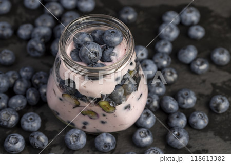 fresh cold yogurt with the taste and berries of ripe blueberries fresh cold yogurt with the taste and berries of ripe blueberries 118613382