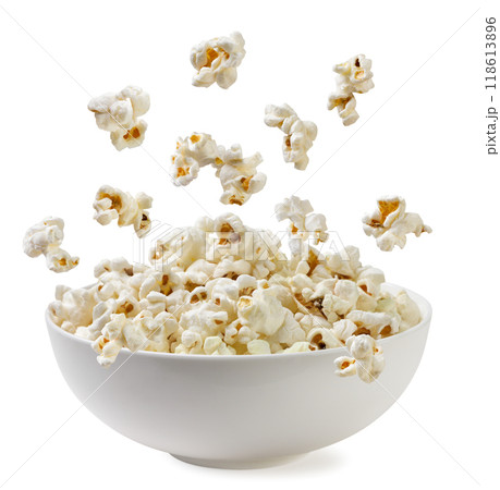 Popcorn falling into a plate on a white background. Isolated 118613896