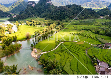 Aerial landscape in Quay Son river, Trung Khanh, Cao Bang, Vietnam with nature, green rice fields and rustic indigenous houses. 118615251