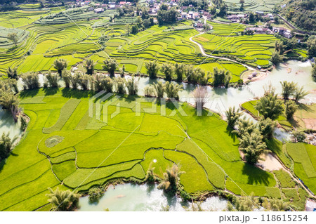 Aerial landscape in Quay Son river, Trung Khanh, Cao Bang, Vietnam with nature, green rice fields and rustic indigenous houses. Aerial landscape in Quay Son river, Trung Khanh, Cao Bang, Vietnam with nature, green rice fields and rustic indigenous houses. 118615254