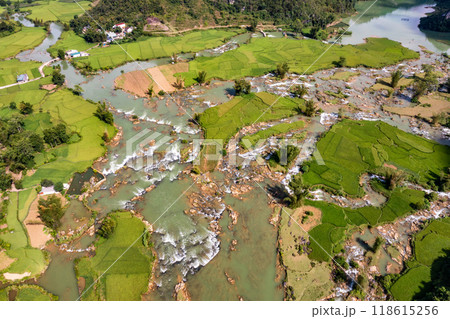 Aerial landscape in Quay Son river, Trung Khanh, Cao Bang, Vietnam with nature, green rice fields and rustic indigenous houses. 118615256