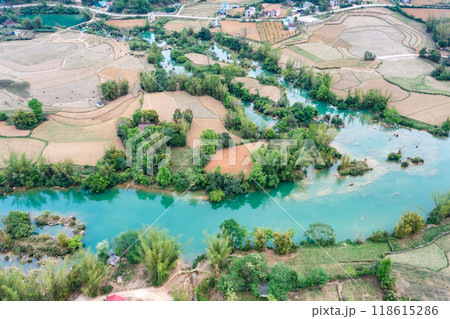 Aerial landscape in Quay Son river, Trung Khanh, Cao Bang, Vietnam with nature, green rice fields and rustic indigenous houses. Aerial landscape in Quay Son river, Trung Khanh, Cao Bang, Vietnam with nature, green rice fields and rustic indigenous houses. 118615286