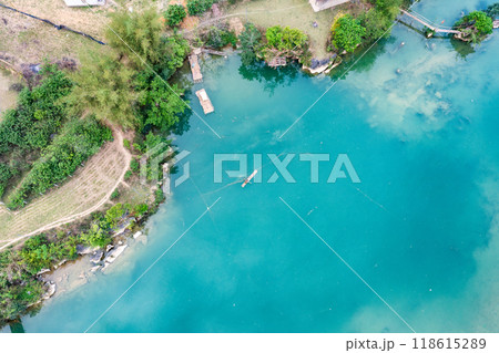 Aerial landscape in Quay Son river, Trung Khanh, Cao Bang, Vietnam with nature, green rice fields and rustic indigenous houses. 118615289
