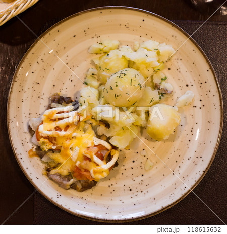 French meat with boiled potatoes served on plate. top view 118615632