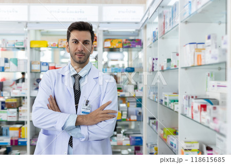 Portrait male charming smiling pharmacist arms crossed looking at camera. 118615685