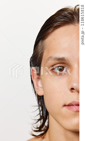 Half-portrait. Detailed photo of young attractive man wet after shower, with well-kept, soft skin against white studio background. 118615818