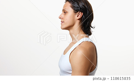 Side view photo of young brunette man with wet hair after shower in white T-shirt looking forward against white background. Side view photo of young brunette man with wet hair after shower in white T-shirt looking forward against white background. 118615835
